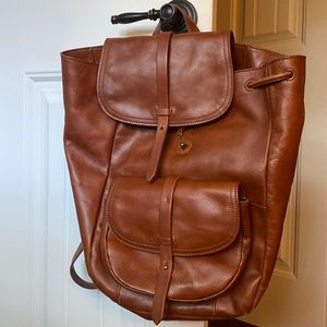 Brown leather backpack from Madewell.